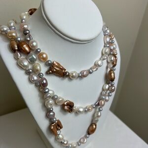 Classic. Elegant. Pearl beads. Costume jewelry, but deceptively authentic.